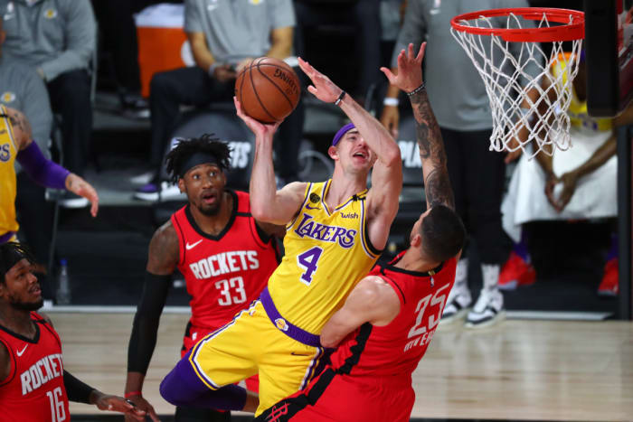 Houston Rockets guard Austin Rivers (25) fouls Los Angeles Lakers guard Alex Caruso (4) in the first half in game four of the second round of the 2020 NBA Playoffs at AdventHealth Arena.